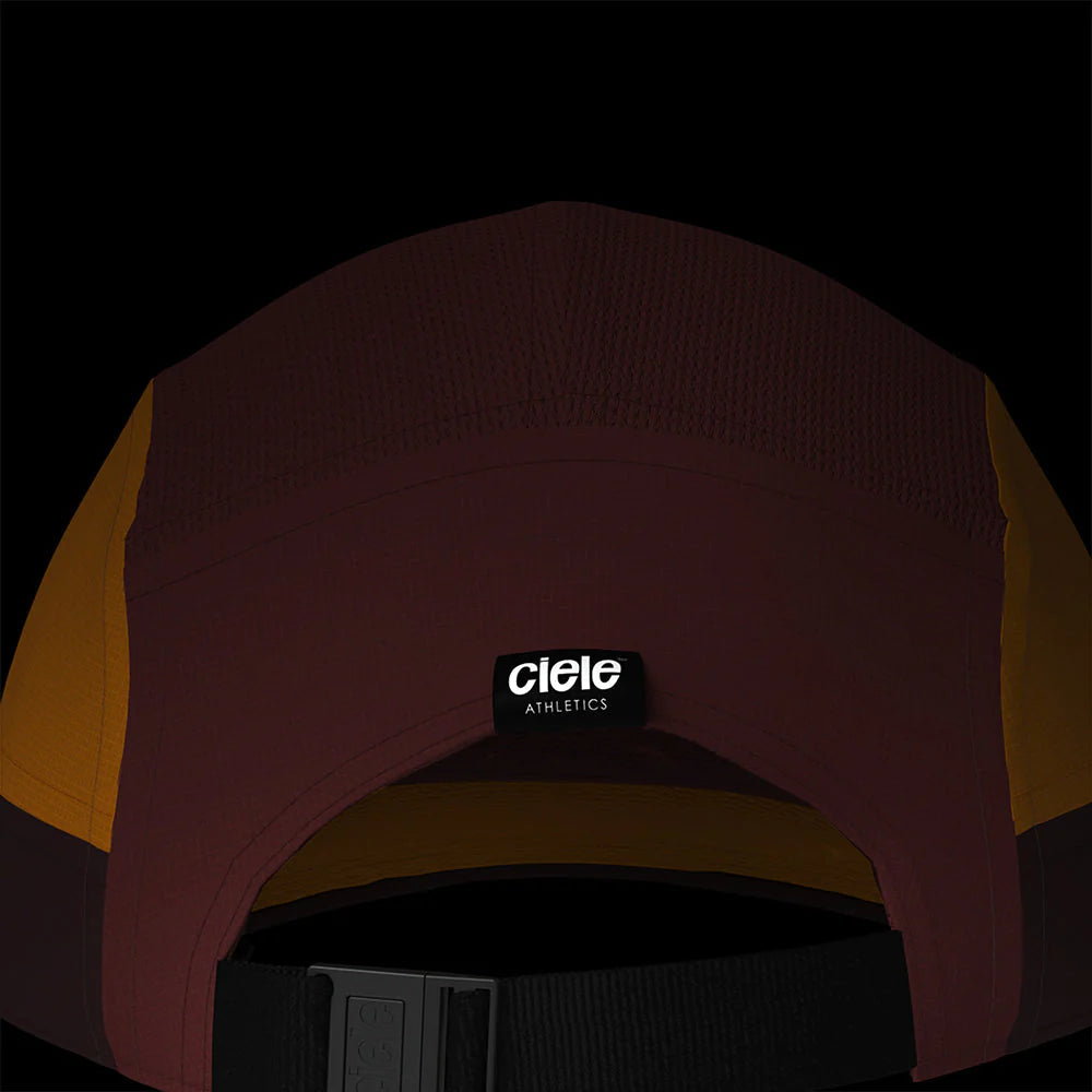 Ciele Athletics GOCap SC - C Plus Box in Rok Rouge from the rear on a dark background to show the reflective detailing.