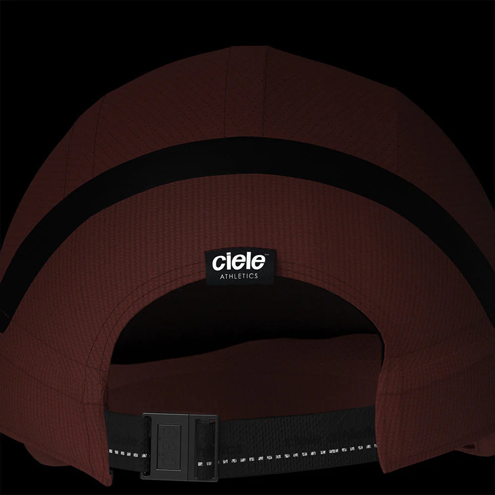 Ciele Athletics RDCap SC in Rouge on a dark background to show the reflective tag on the rear.