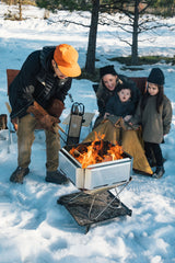 Takibi Fire & Grill Set camping fireplace being used outdoors.