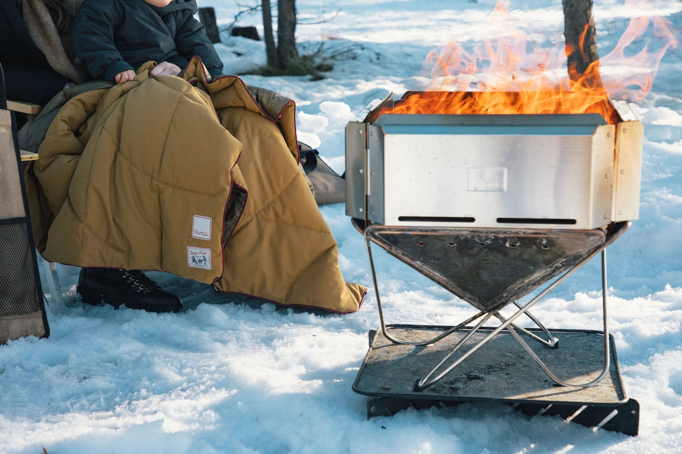 Takibi Fire & Grill Set camping fireplace being used outdoors.