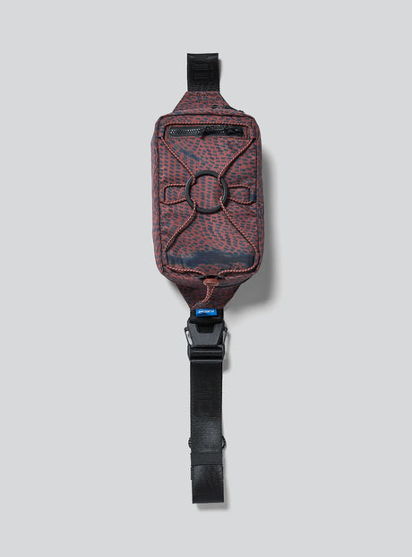 Janji Multipass Mini 1L running sling bag in Shadowlands on a neutral background.