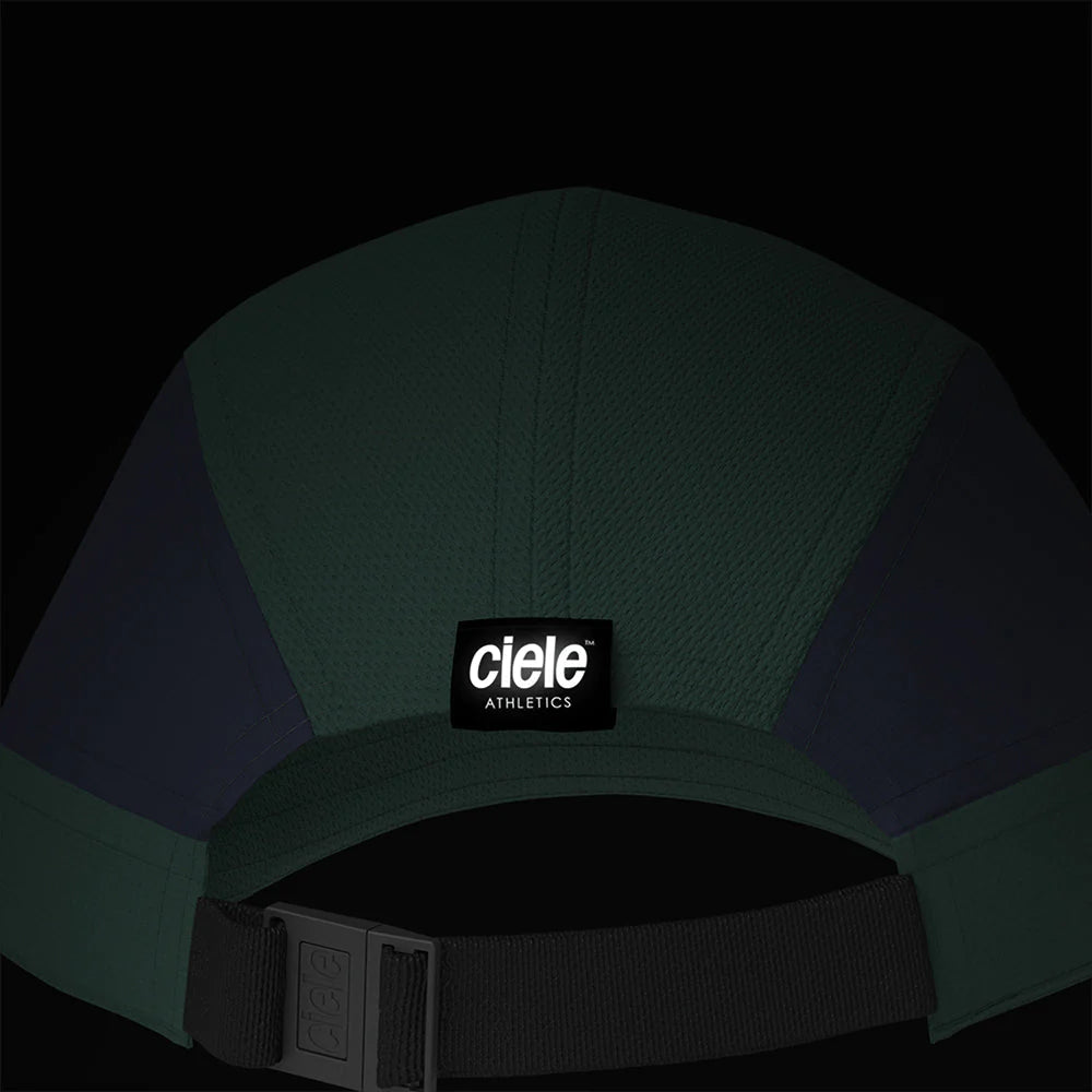 Ciele Athletics ALZCap SC in Spruce from the rear on a dark background to show the reflective detailing.