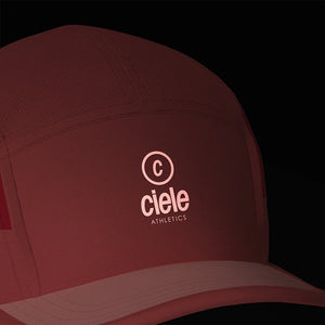 Ciele Athletics ALZCap SC in Tropograph from the front on a dark background to show the reflective detailing.