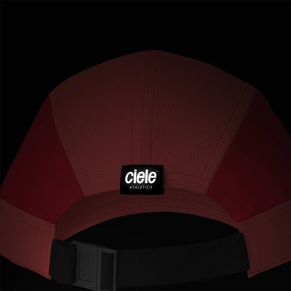 Ciele Athletics ALZCap SC in Tropograph from the rear on a dark background to show the reflective detailing.