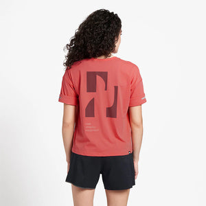 Ciele Athletics WNSBTShirt - Pieces in Tropograph worn by a woman from the rear on a neutral background.