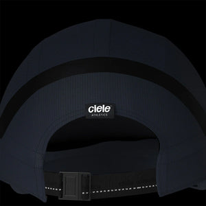 Ciele Athletics RDCap SC in Uniform on a dark background to show the reflective tag on the rear.