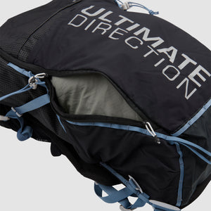 The Ultimate Direction Fastpack 20 on a neutral background, showing the back zipper.