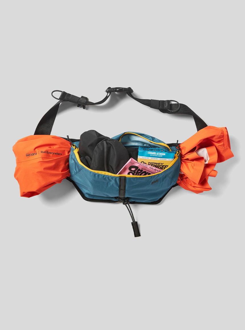 Janji Multipass Sling Bag on a neutral background.