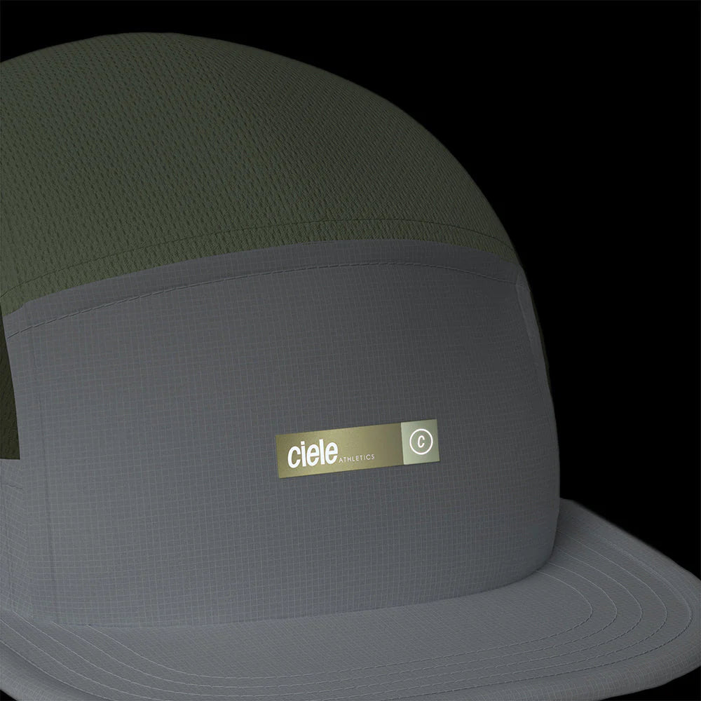 Ciele Athletics ALZCap - Horizon in Willow from the front on a dark background to show the reflective detailing.