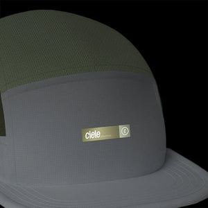 Ciele Athletics ALZCap - Horizon in Willow from the front on a dark background to show the reflective detailing.
